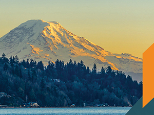 Photo of Mount Rainier with orange and blue color banners at the bottom right
